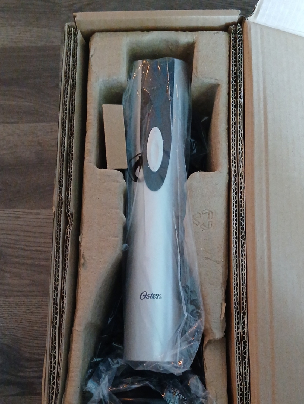 Oster Electric Wine Opener Box Label with Brown and White Tones